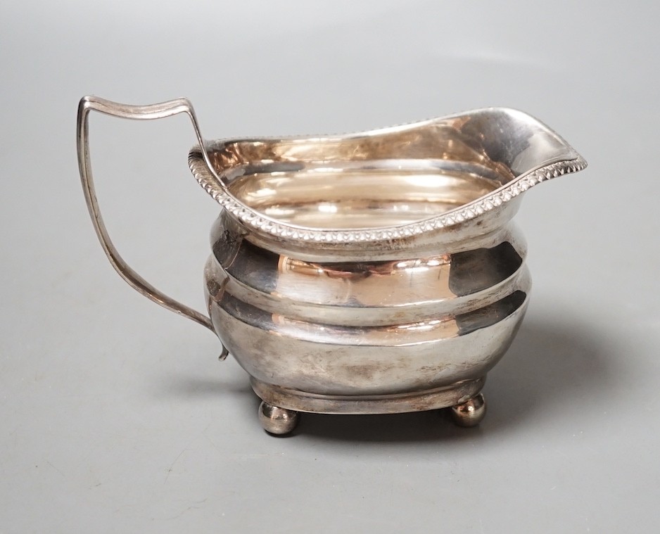 A George III silver cream jug, marks rubbed, 154 grams.